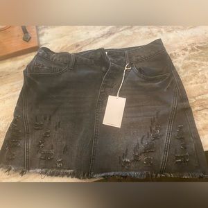 - Distressed black denim skirt